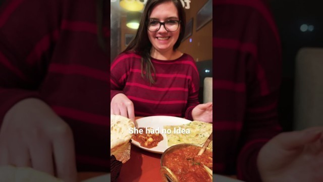 'Foreigner girl trying spicy Indian food 