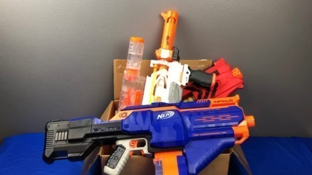 'Box Full of Toy Guns and Nerf Blasters for Kids'