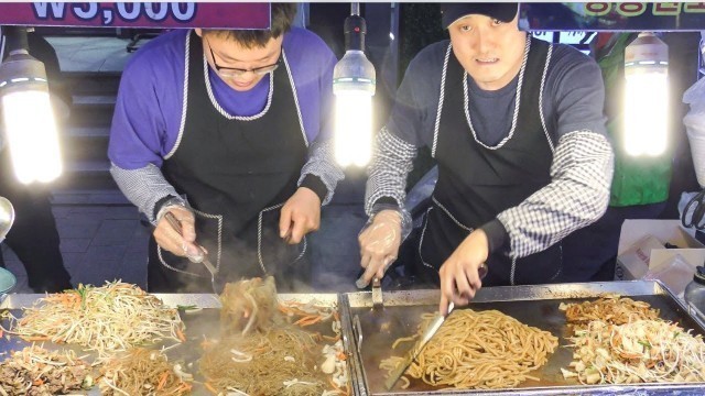 'Korea Street Food. \'Bulgogi Japchae\' and \'Yaki\' Noodles. Myeongdong, Seoul'