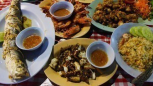 'Thai Street Food: A Seafood Feast at a Night Market in Thailand'