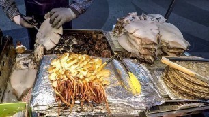 'Grilled Squid and Deep-Fried Shrimps, Octopus, Crabs. Korea Street Food. Myeongdong, Seoul'