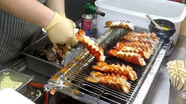 'Melted Cheese over Roasted Lobsters. Korea Street Food in Myeongdong, Seoul'