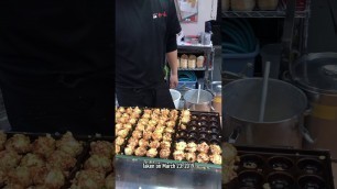 'Takoyaki seller at Dotonbori Osaka'