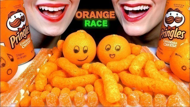 'ASMR ORANGE FOOD RACE, CHEESE CURLS, CHEDDAR PRINGLES, MANDARIN ORANGES, BIG NERDS, HARIBO STREAMERS'