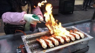 'Cheese baked lobsters and scallops, Myeongdong street food ล็อบสเตอร์ หอยเชลล์ อบชีส ที่ตลาดเมียงดง'