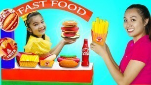 'Hana Pretend Play Selling Fast Food Toys at her Cardboard Restaurant Food Cart'