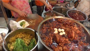 'Thai Street Food in Bangkok. Meat, Seafood, Skewers, Pad Thai at Taling Chan Floating Market'