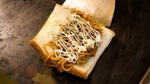 'Japanese Street Food - YAKISOBA Bread SandwickFried Noodles Kuromon Osaka Japan'