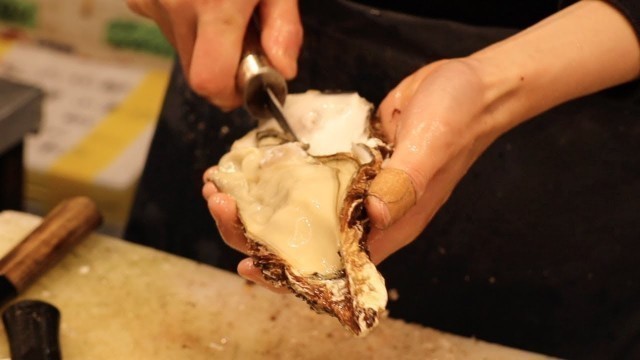 'Japanese Street Food - Oyster Sea urchin Seafood Kuromon Osaka Japan'