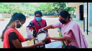 'SJCGHS Principal and staff distribute food grains to the needy during quarantine.'