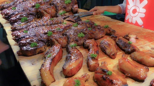 'The Biggest Street Food Market in Phuket. Ribs, Ducks, Fried Meat, Seafood. Thalang Road. Thailand'