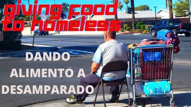 'GIVING FOOD & PRAYING FOR HOMELESS. DANDO ALIMENTO Y ORANDO POR DESAMPARADO.'