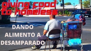 'GIVING FOOD & PRAYING FOR HOMELESS. DANDO ALIMENTO Y ORANDO POR DESAMPARADO.'